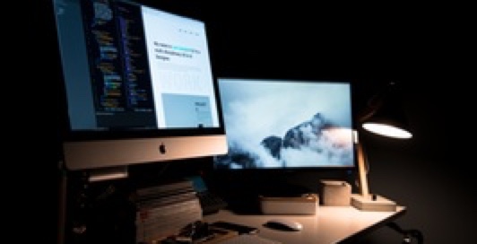 Dual computer monitor set up to work in a dark room